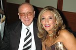 Clive Davis and Denise Rich at a party to celebrate the August nuptials of comic Daniella Rich and real-estate maven Richard Kilstock  at Pier 60 in Manhattan on October 7, 2004. photo by Rob Rich copyright 2004. 516-676-3939 robwayne1@aol.com