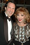Percy Gibson and Joan Collins at the Rita Hayworth Alzheimer's Ball at the Warldorf Astoria  in Manhattan , N.Y. on October 5, 2004.<br>(photo by Rob Rich copyright 2004 516-676-3939)