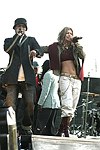 NEW YORK - MAY 8: apl.de.ap and Fergie of the &quotBlack Eyed Peas&quot perform  at the American Express &quotLive At The Battery&quot Concert during the 2004 Tribeca Film Festival May 8, 2004 in New York City. <br>  (Photo by Rob Rich/Getty Images) 
