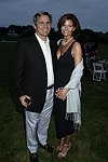  Rudy and Lydia Touzet at the 8th. Annual Orchid Ball  to benefit the Child Developement Center of the Hamptons on July 24, 2004 at the Villa Maria in Watermill. photo by Rob Rich copyright 2004 516-676-3939  robwayne1@aol.com