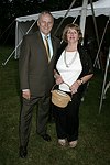 Jim & Ginny Comley   at the 8th. Annual Orchid Ball  to benefit the Child Developement Center of the Hamptons on July 24, 2004 at the Villa Maria in Watermill. photo by Rob Rich copyright 2004 516-676-3939  robwayne1@aol.com