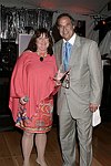 Joann Ross and Stewart F. Lane  at the 8th. Annual Orchid Ball  to benefit the Child Developement Center of the Hamptons on July 24, 2004 at the Villa Maria in Watermill. photo by Rob Rich copyright 2004 516-676-3939  robwayne1@aol.com