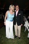 Paola and Arnie Rosenshein  at the 8th. Annual Orchid Ball  to benefit the Child Developement Center of the Hamptons on July 24, 2004 at the Villa Maria in Watermill. photo by Rob Rich copyright 2004 516-676-3939  robwayne1@aol.com