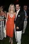 Colleen and Gary Rein  at the 8th. Annual Orchid Ball  to benefit the Child Developement Center of the Hamptons on July 24, 2004 at the Villa Maria in Watermill. photo by Rob Rich copyright 2004 516-676-3939  robwayne1@aol.com