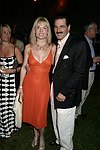 Colleen and Gary Rein  at the 8th. Annual Orchid Ball  to benefit the Child Developement Center of the Hamptons on July 24, 2004 at the Villa Maria in Watermill. photo by Rob Rich copyright 2004 516-676-3939  robwayne1@aol.com
