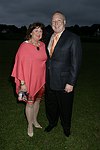 Joann Ross and Michael Zelamn   at the 8th. Annual Orchid Ball  to benefit the Child Developement Center of the Hamptons on July 24, 2004 at the Villa Maria in Watermill. photo by Rob Rich copyright 2004 516-676-3939  robwayne1@aol.com