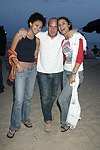 Monique Darton, Noah Teppenberg, and Giulliana Weston at the annual Hamptons Clambake at Flying Point Beach in Watermill on 7-11-04<br>photo by Rob Rich copyright 2004 516-676-3939 robwayne1@aol.com