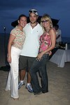 Tressa Weg Recanati ,Gregg Bello, and Arlene Kuljis at the annual Hamptons Clambake at Flying Point Beach in Watermill on 7-11-04<br>photo by Rob Rich copyright 2004 516-676-3939 robwayne1@aol.com