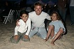 Tim Schifter with kids at the annual Hamptons Clambake at Flying Point Beach in Watermill on 7-11-04<br>photo by Rob Rich copyright 2004 516-676-3939 robwayne1@aol.com