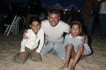 Tim Schifter with kids at the annual Hamptons Clambake at Flying Point Beach in Watermill on 7-11-04<br>photo by Rob Rich copyright 2004 516-676-3939 robwayne1@aol.com