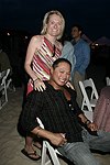 Gwen Snyder and Nathaniel Manapat at the annual Hamptons Clambake at Flying Point Beach in Watermill on 7-11-04<br>photo by Rob Rich copyright 2004 516-676-3939 robwayne1@aol.com