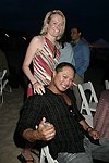 Gwen Snyder and Nathaniel Manapat at the annual Hamptons Clambake at Flying Point Beach in Watermill on 7-11-04<br>photo by Rob Rich copyright 2004 516-676-3939 robwayne1@aol.com