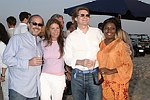 Mark Ehret, Jennifer Miller, tim Hindert, and Gillian Harding at the annual Hamptons Clambake at Flying Point Beach in Watermill on 7-11-04<br>photo by Rob Rich copyright 2004 516-676-3939 robwayne1@aol.com