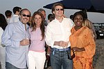 Mark Ehret, Jennifer Miller, tim Hindert, and Gillian Harding at the annual Hamptons Clambake at Flying Point Beach in Watermill on 7-11-04<br>photo by Rob Rich copyright 2004 516-676-3939 robwayne1@aol.com