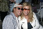 Todd and Jennifer Klein at the annual Hamptons Clambake at Flying Point Beach in Watermill on 7-11-04<br>photo by Rob Rich copyright 2004 516-676-3939 robwayne1@aol.com