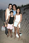 Carolyn,Layla, Jelly Bean, and Reya Benitez at the annual Hamptons Clambake at Flying Point Beach in Watermill on 7-11-04<br>photo by Rob Rich copyright 2004 516-676-3939 robwayne1@aol.com