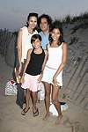 Carolyn,Layla, Jelly Bean, and Reya Benitez at the annual Hamptons Clambake at Flying Point Beach in Watermill on 7-11-04<br>photo by Rob Rich copyright 2004 516-676-3939 robwayne1@aol.com