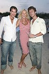 Paul Couglin, Edie Kirk, and Paul Preiss at the annual Hamptons Clambake at Flying Point Beach in Watermill on 7-11-04<br>photo by Rob Rich copyright 2004 516-676-3939 robwayne1@aol.com