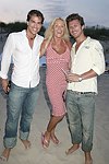 Paul Couglin, Edie Kirk, and Paul Preiss at the annual Hamptons Clambake at Flying Point Beach in Watermill on 7-11-04<br>photo by Rob Rich copyright 2004 516-676-3939 robwayne1@aol.com