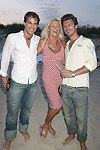 Paul Couglin, Edie Kirk, and Paul Preiss at the annual Hamptons Clambake at Flying Point Beach in Watermill on 7-11-04<br>photo by Rob Rich copyright 2004 516-676-3939 robwayne1@aol.com