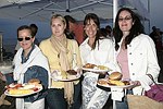 Mara Gibbs, Ann Lawlor, Susan Consentino, and Nora Lawlor at the annual Hamptons Clambake at Flying Point Beach in Watermill on 7-11-04<br>photo by Rob Rich copyright 2004 516-676-3939 robwayne1@aol.com