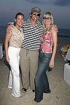 Tressa Weg Recanati , Donega; Fitzgerald, and Arlene Kuljis at the annual Hamptons Clambake at Flying Point Beach in Watermill on 7-11-04<br>photo by Rob Rich copyright 2004 516-676-3939 robwayne1@aol.com