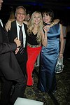 Jane and Paul Schindler with Sale Johnson at a party to celebrate the August nuptials of comic Daniella Rich and real-estate maven Richard Kilstock  at Pier 60 in Manhattan on October 7, 2004. photo by Rob Rich copyright 2004. 516-676-3939 robwayne1@aol.com