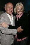Barry Diller and Nancy Janicki at the  Diane von Furstenberg fashion show  in Manhattan, N.Y. on September 12, 2004.<br>(photo by Rob Rich/ The Everett Collection)