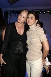 Ellen Barkin and Marisa  Tomei at the  Diane von Furstenberg fashion show  in Manhattan, N.Y. on September 12, 2004.<br>(photo by Rob Rich/ The Everett Collection)