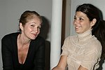Ellen Barkin and Marisa  Tomei at the  Diane von Furstenberg fashion show  in Manhattan, N.Y. on September 12, 2004.<br>(photo by Rob Rich/ The Everett Collection)