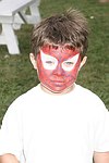 Painted face at the Albert Einstein College of Medicine's Family Day Carnival at the Villa Maria in Watermill on 8-15-04<br>  photo by Rob Rich copyright 2004 516-676-3939  robwayne1@aol.com