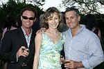 Eric Lustgarten, Irina and Roger Erickson at the Southampton residence of Jeff Furman on 6-19-04<br>photo by Rob Rich copyright 2004   516-676-3939