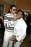 NEW YORK - MAY 29: Starr Jones get a strawberry from her fiancee' at the Hampton's Magazine Party at Jason Binn's Southampton residence on May 29, 2004<br>(photo by Rob Rich/Getty Images)