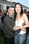 NEW YORK - MAY 29: John Roca and Rosalyn Jang  at the Hampton's Magazine Party at Jason Binn's Southampton residence on May 29, 2004<br>(photo by Rob Rich/Getty Images)