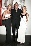 Levent Piskiner with Gilan jewelry models at the Parrish Art Museum's Midsummer   Gala in Southampton, N.Y. on July 17, 2004. photo by Rob Rich copyright 2004 516-676-3939 robwayne1@aol.com 112 12th. Ave, Sea Cliff, N.Y. 11579 USA