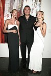 Levent Piskiner with Gilan jewelry models at the Parrish Art Museum's Midsummer   Gala in Southampton, N.Y. on July 17, 2004. photo by Rob Rich copyright 2004 516-676-3939 robwayne1@aol.com 112 12th. Ave, Sea Cliff, N.Y. 11579 USA