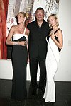 Levent Piskiner with Gilan jewelry models at the Parrish Art Museum's Midsummer   Gala in Southampton, N.Y. on July 17, 2004. photo by Rob Rich copyright 2004 516-676-3939 robwayne1@aol.com 112 12th. Ave, Sea Cliff, N.Y. 11579 USA