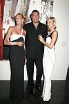 Levent Piskiner with Gilan jewelry models at the Parrish Art Museum's Midsummer   Gala in Southampton, N.Y. on July 17, 2004. photo by Rob Rich copyright 2004 516-676-3939 robwayne1@aol.com 112 12th. Ave, Sea Cliff, N.Y. 11579 USA