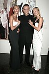 CEO of Gilan Ferhan Geylan with models wearing Gilan jewelry designs at the Parrish Art Museum's Midsummer   Gala in Southampton, N.Y. on July 17, 2004. photo by Rob Rich copyright 2004 516-676-3939 robwayne1@aol.com 112 12th. Ave, Sea Cliff, N.Y. 11579 USA