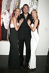 Levent Piskiner with Gilan jewelry models at the Parrish Art Museum's Midsummer   Gala in Southampton, N.Y. on July 17, 2004. photo by Rob Rich copyright 2004 516-676-3939 robwayne1@aol.com 112 12th. Ave, Sea Cliff, N.Y. 11579 USA