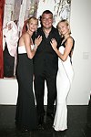 Levent Piskiner with Gilan jewelry models at the Parrish Art Museum's Midsummer   Gala in Southampton, N.Y. on July 17, 2004. photo by Rob Rich copyright 2004 516-676-3939 robwayne1@aol.com 112 12th. Ave, Sea Cliff, N.Y. 11579 USA
