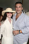  Trish Bennett and George Hirsch at the Mercedes Benz Polo Challenge on July 17, 2004 in Bridgehampton, N.Y.  photo by Rob Rich copyright 2004<br>516-676-3939 robwayne1@aol.com