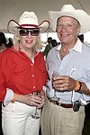 Erin O'brien and Herb Roberts  at the Mercedes Benz Polo Challenge on July 17, 2004 in Bridgehampton, N.Y.  photo by Rob Rich copyright 2004<br>516-676-3939 robwayne1@aol.com