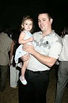 Makenna and Charlie Savnik at the Mercedes Benz Polo Challenge on 8-21-04.  <br>photo by Rob Rich copyright 2004 516-676-3939  robwayne1@aol.com