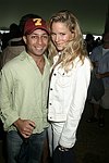 Rahul Baig and Zelmira Koch at the Mercedes Benz Polo Challenge on 8-21-04.  <br>photo by Rob Rich copyright 2004 516-676-3939  robwayne1@aol.com