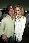 Rahul Baig and Zelmira Koch at the Mercedes Benz Polo Challenge on 8-21-04.  <br>photo by Rob Rich copyright 2004 516-676-3939  robwayne1@aol.com