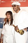 Guest and LL Cool J at the Sean P. Diddy Coombs  annual White Party on July 4, 2004at the Sony Playstation 2 Estate in Bridgehampton, N.Y.  (Photo by Rob Rich/Everett Collection)