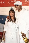 Guest and LL Cool J at the Sean P. Diddy Coombs  annual White Party on July 4, 2004at the Sony Playstation 2 Estate in Bridgehampton, N.Y.  (Photo by Rob Rich/Everett Collection)