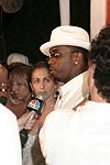 Sean Coombs being interviewed at the Sean P. Diddy Coombs  annual White Party on July 4, 2004at the Sony Playstation 2 Estate in Bridgehampton, N.Y.  (Photo by Rob Rich/Everett Collection)