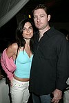  Jennifer Martin and Steve Pinkos at the after party for the movie premiere of 'RIDING GIANTS' at the Southampton home of Andrew Rosen on 7-2-04<br>photo by Rob Rich copyright 2004  516-676-3939